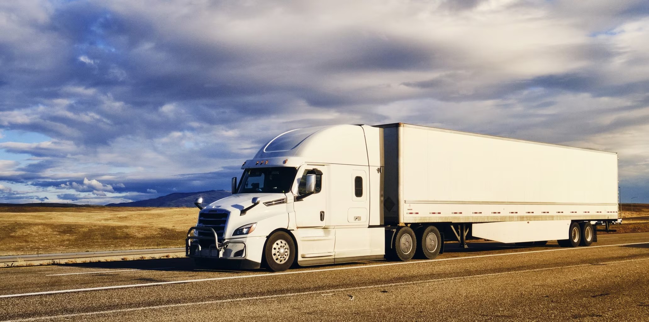 MELTON TRANSPORT LLC tractor and dry van on the highway